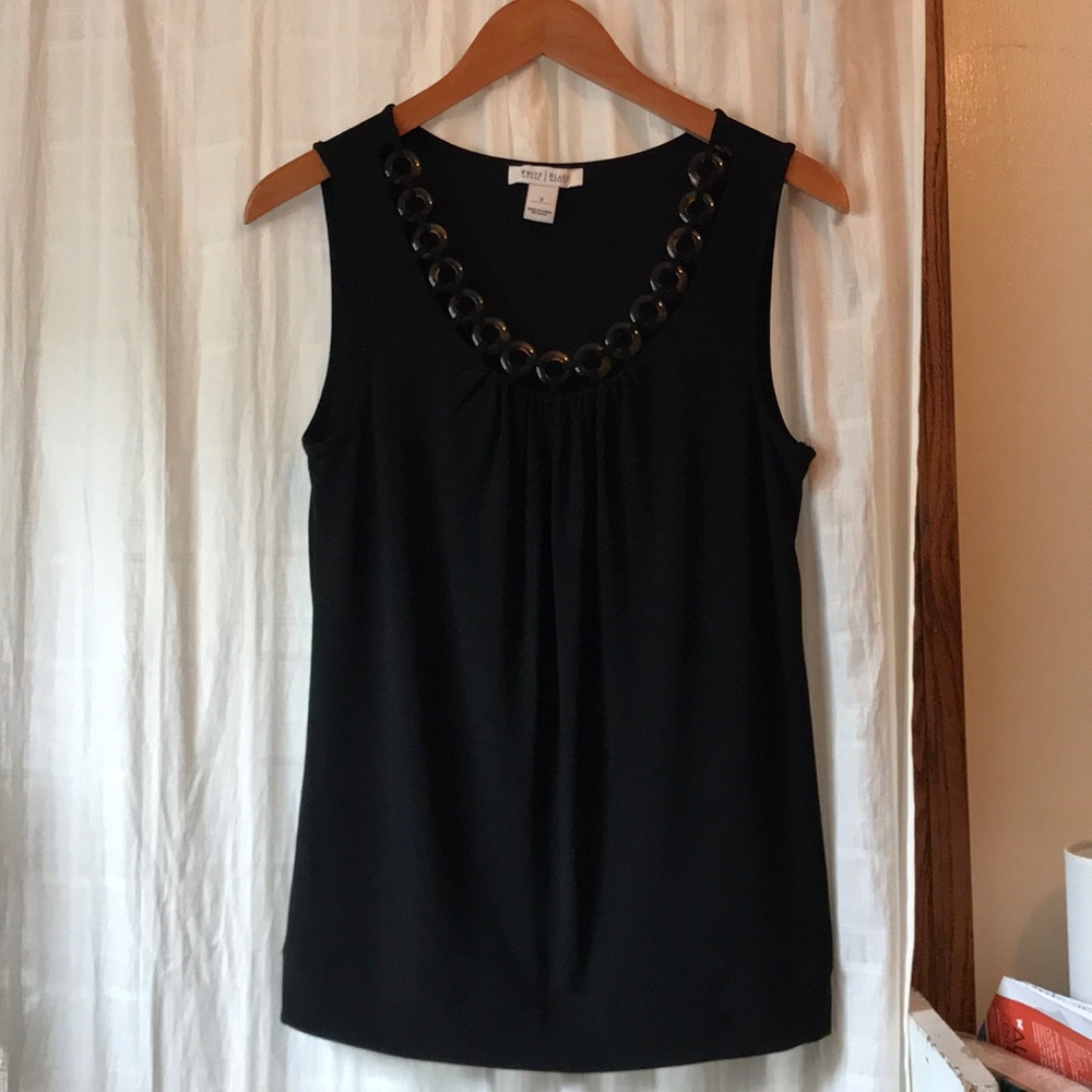 Black sleeveless top.